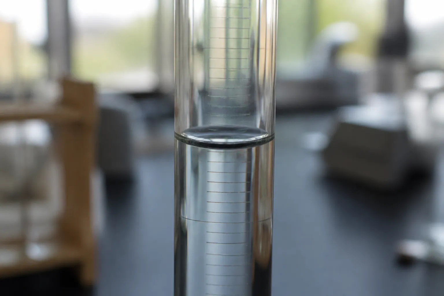 Concave water meniscus viewed at eye level in a graduated cylinder